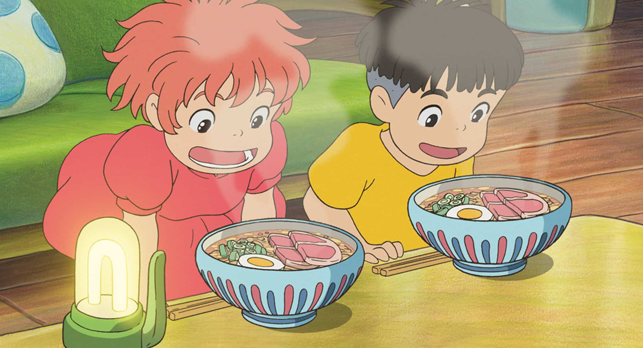 An animated girl and boy excited about ramen in this image from Studio Ghibli.