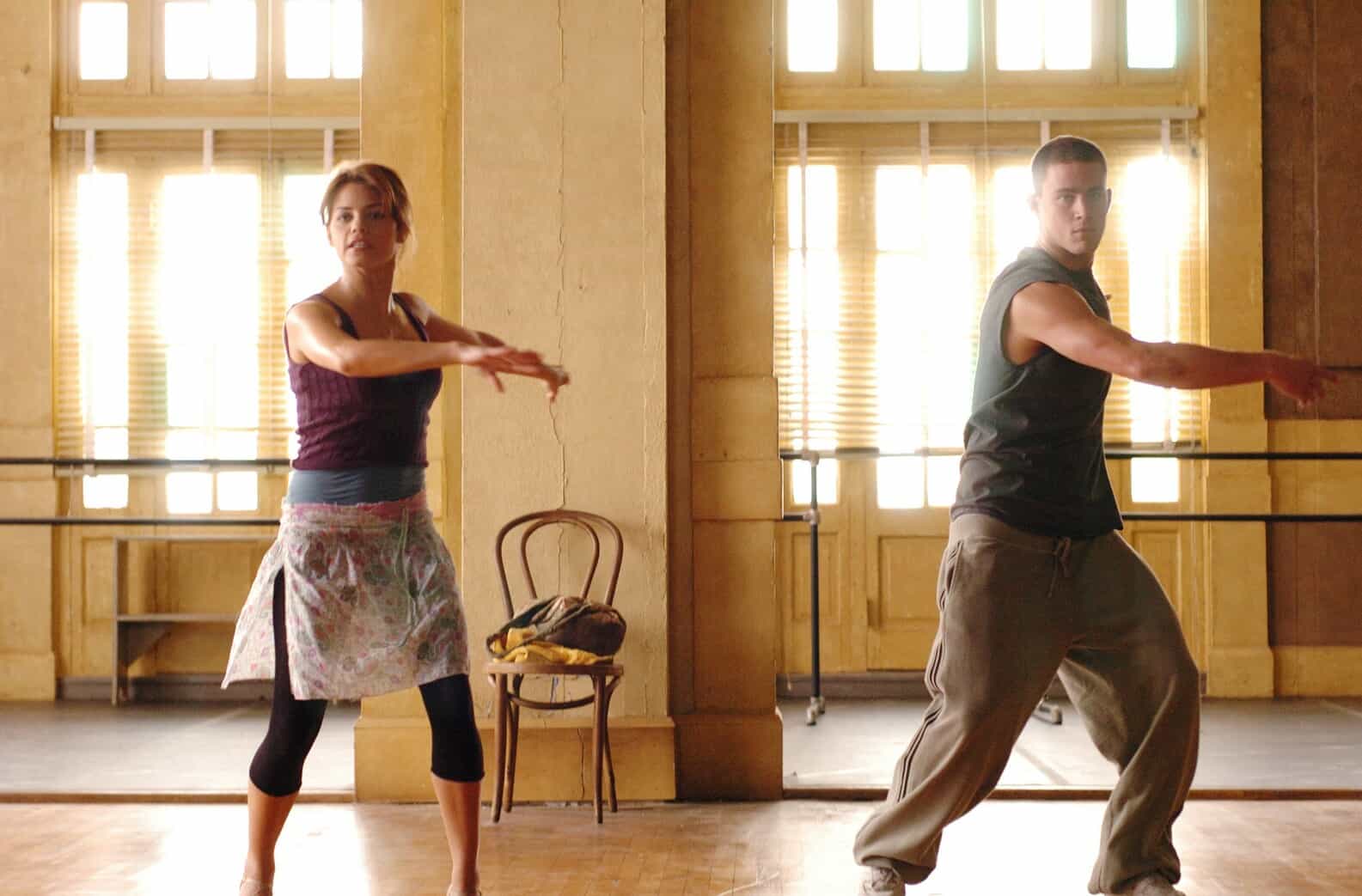 A girl and boy practice a dance routine in a ballet studio in this image from Touchstone Pictures.