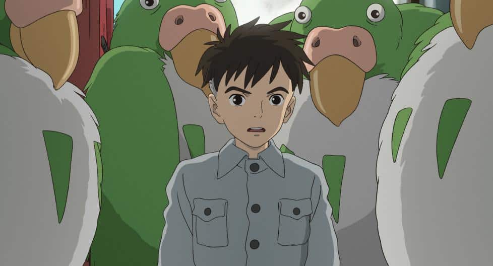 An animated boy surrounded by giant birds in this image from Studio Ghibli.