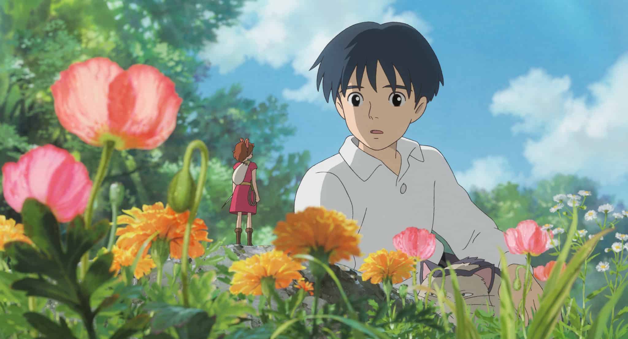 An animated boy talks to a miniature girl in this image from Studio Ghibli.