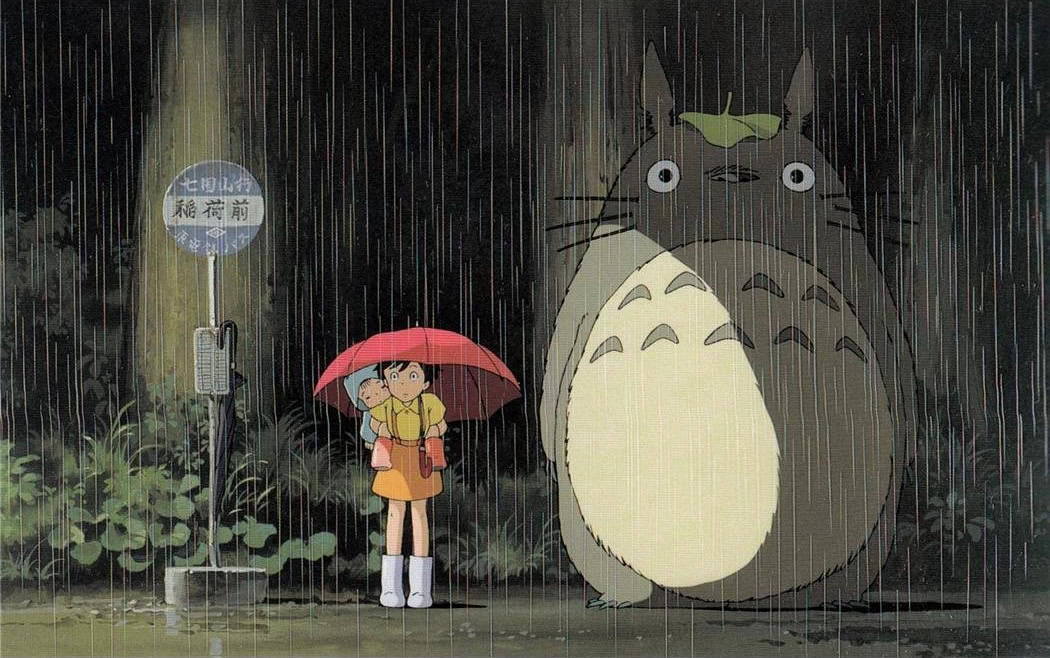 Two animated children and a forest spirit stand in the rain in this image from Studio Ghibli.