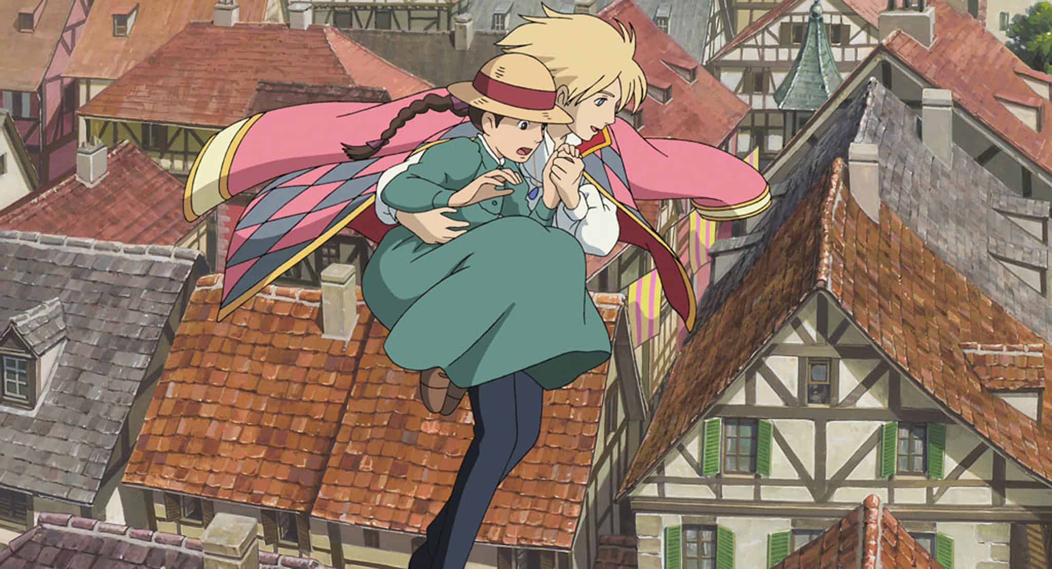 An animated girl and a wizard flying over a town in this image from Studio Ghibli.