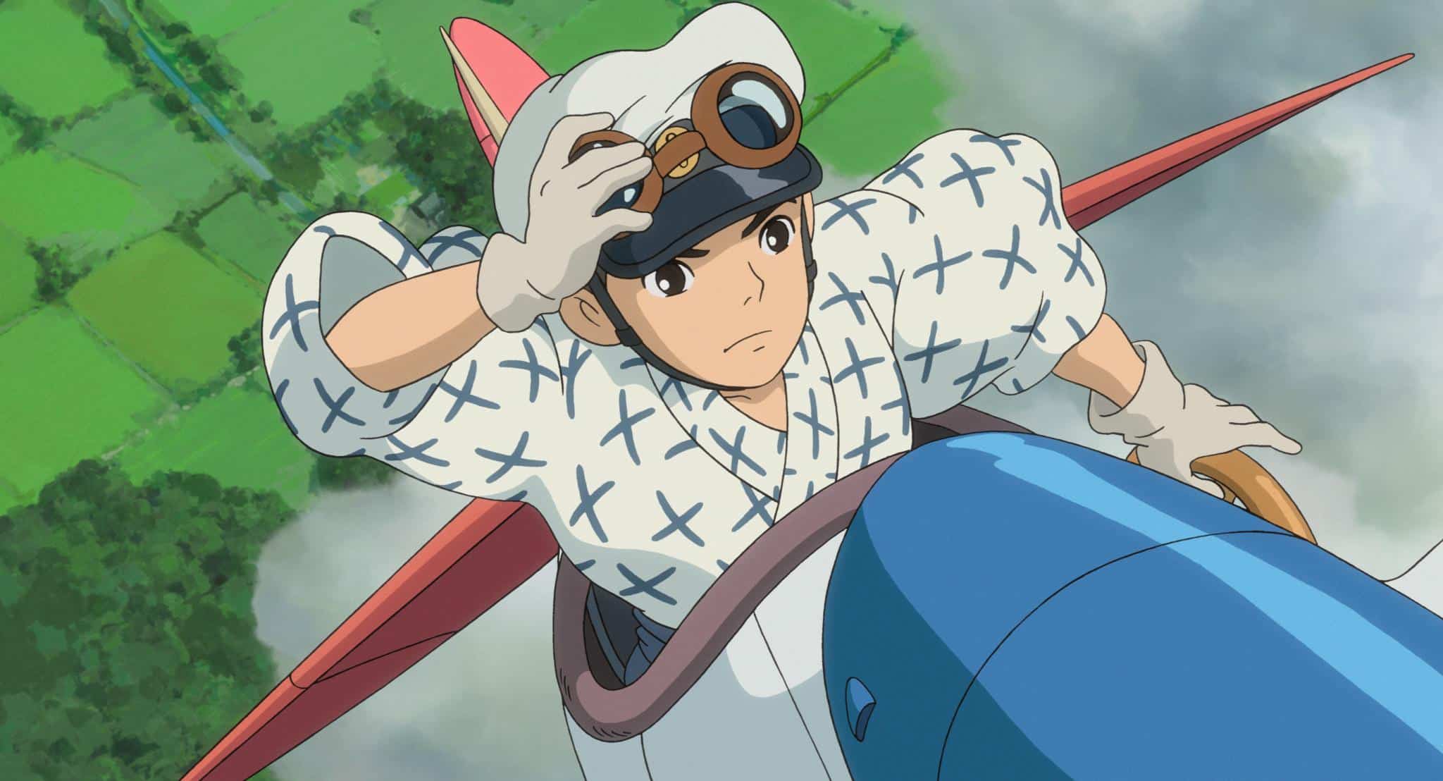 An animated boy in an airplane in this image from Studio Ghibli.